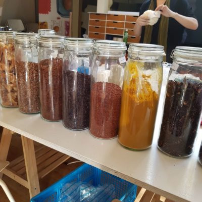 jars with bark and leaves in them