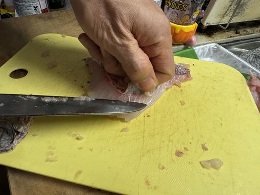 peeling skin with knife