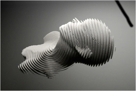 It is a picture of a cut in slices face made with ceramic or a similar material