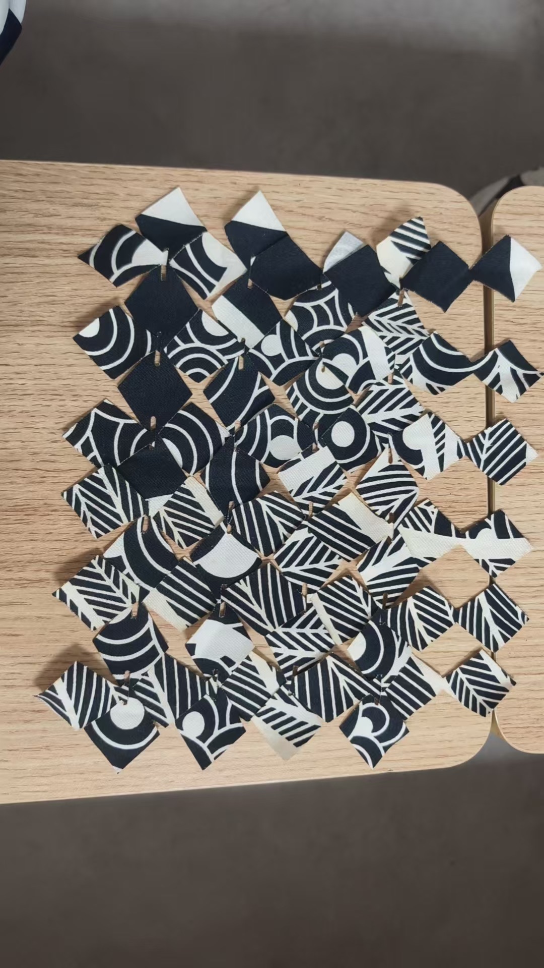 The diamond-slit textile laid out flat on a table