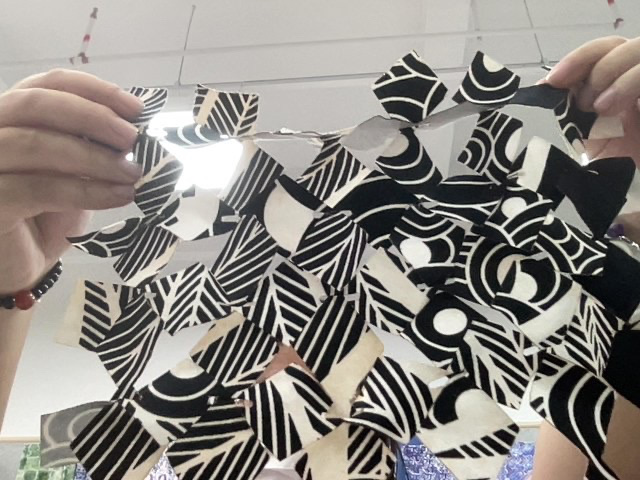 The interlocked textile held up to show the open structure
