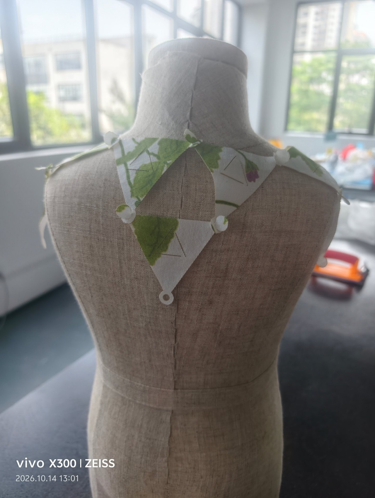 The back view of the modular bib on the dress form