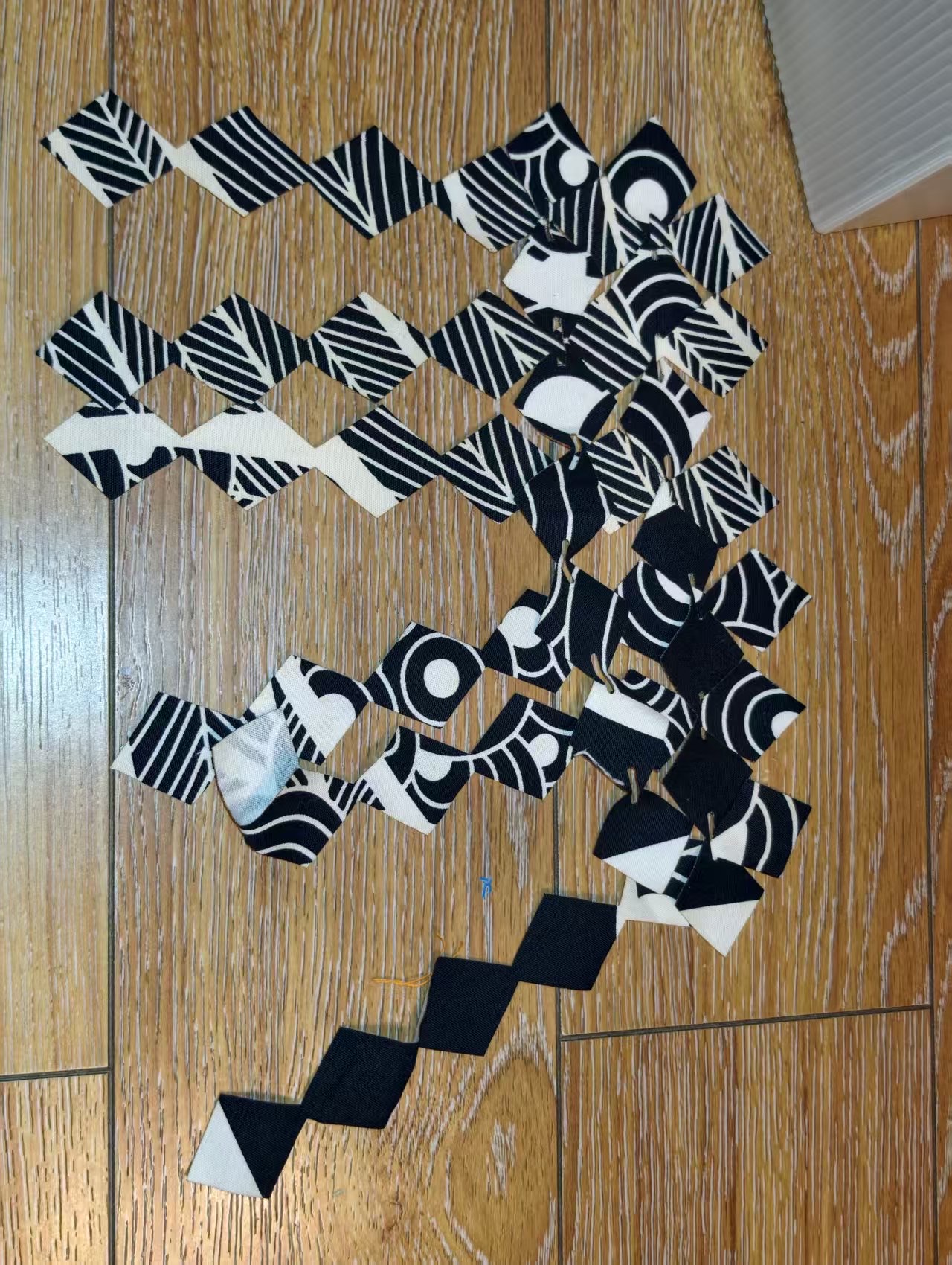 Cut modules and strips spread out on the floor before assembly