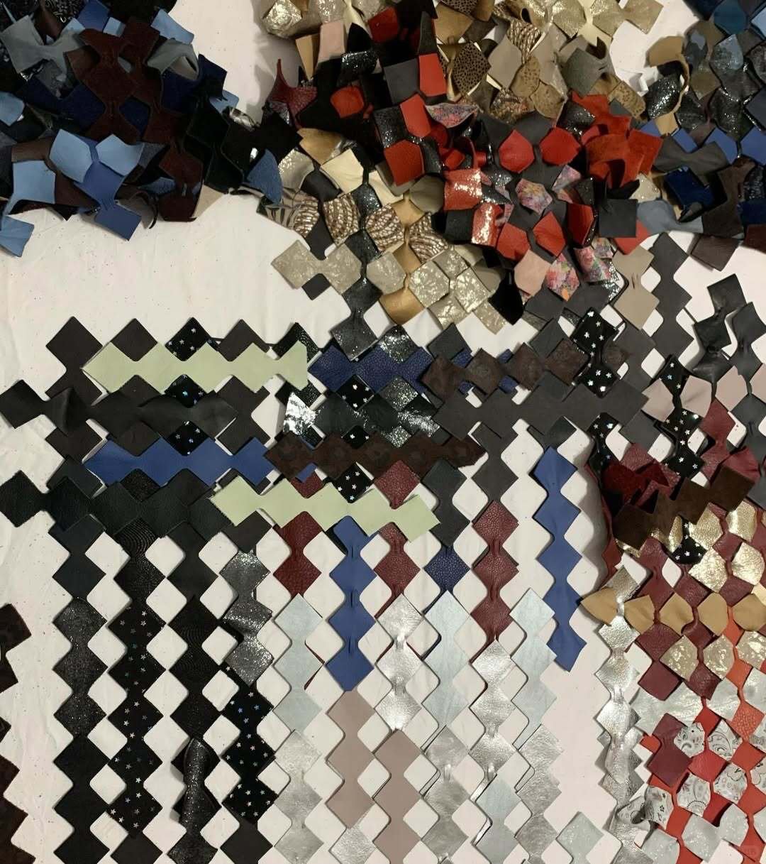 Leather production waste cut into interlocking modules — from Alicja Kamaj's SURRENDER